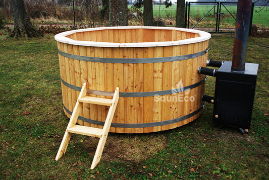 Large wooden hot tub with external log-fired furnace
