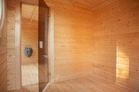 Sauna Jari covered entrance firewood storage