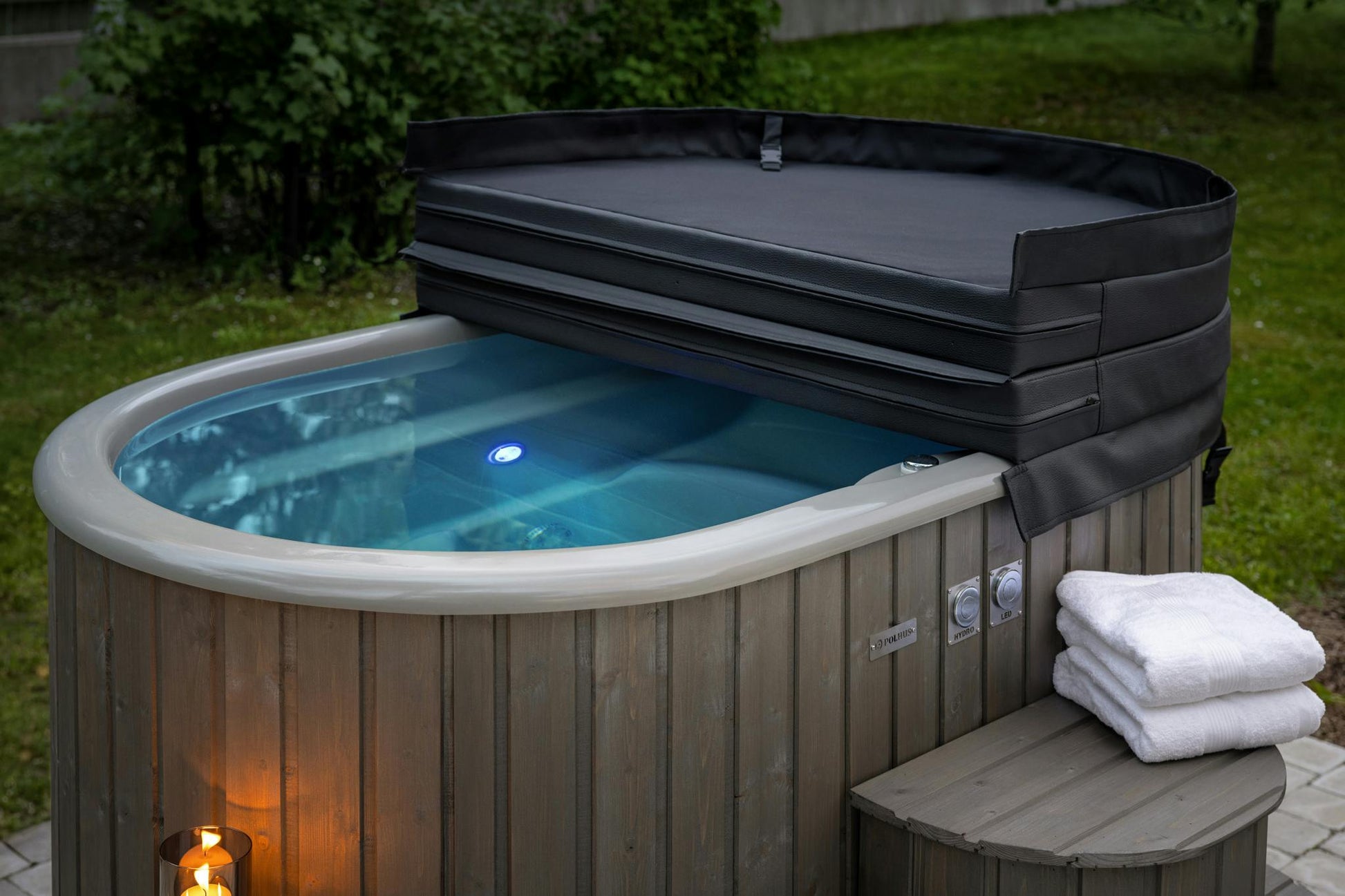 Polar Spa Duo hot tub with cover half open