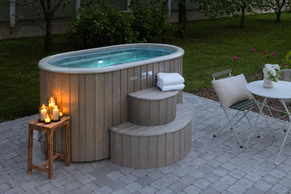 Polar Spa Duo hot tub with RGB lighting at night