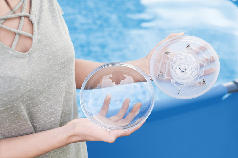 Floating LED light lifestyle in hot tub at night