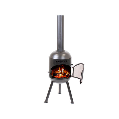 BonFeu BonSolo outdoor fireplace lit with fire in garden setting