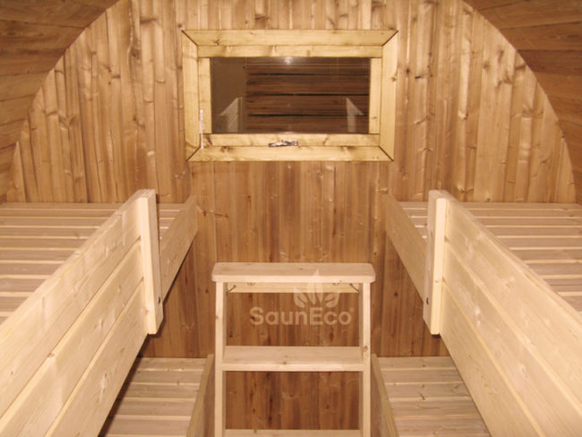 Barrel guest cabin sleeping area with 4 beds for 4 guests