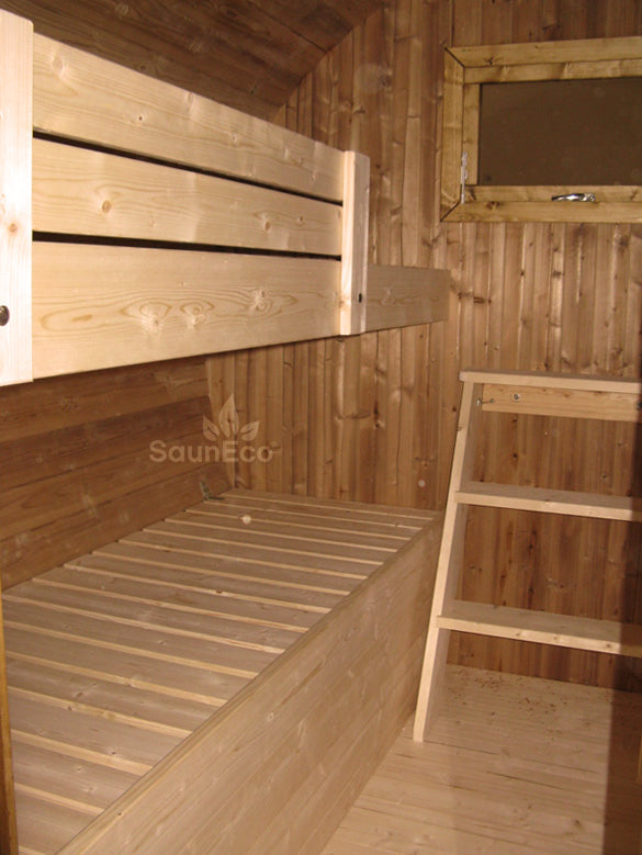 Barrel guest cabin interior showing 4 beds