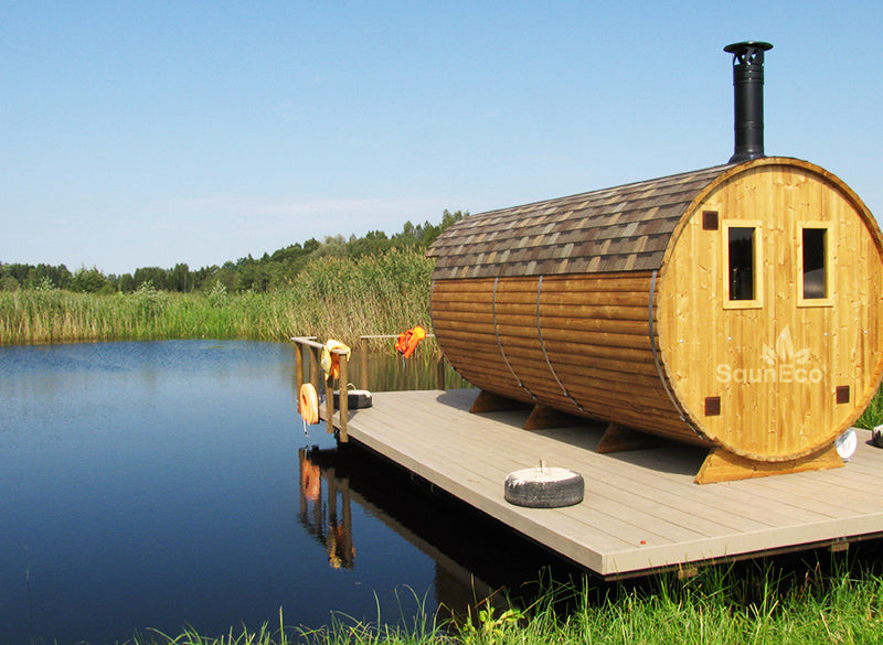 Three room barrel sauna interior showing wood-fired stove