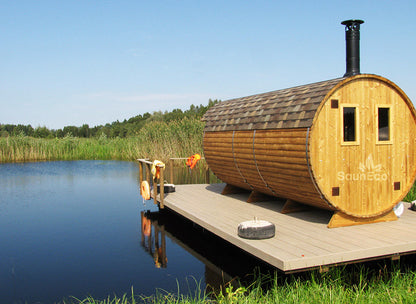 Three room barrel sauna interior showing wood-fired stove