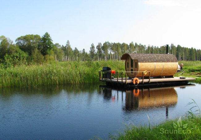 Three room barrel sauna side view showing thermowood construction