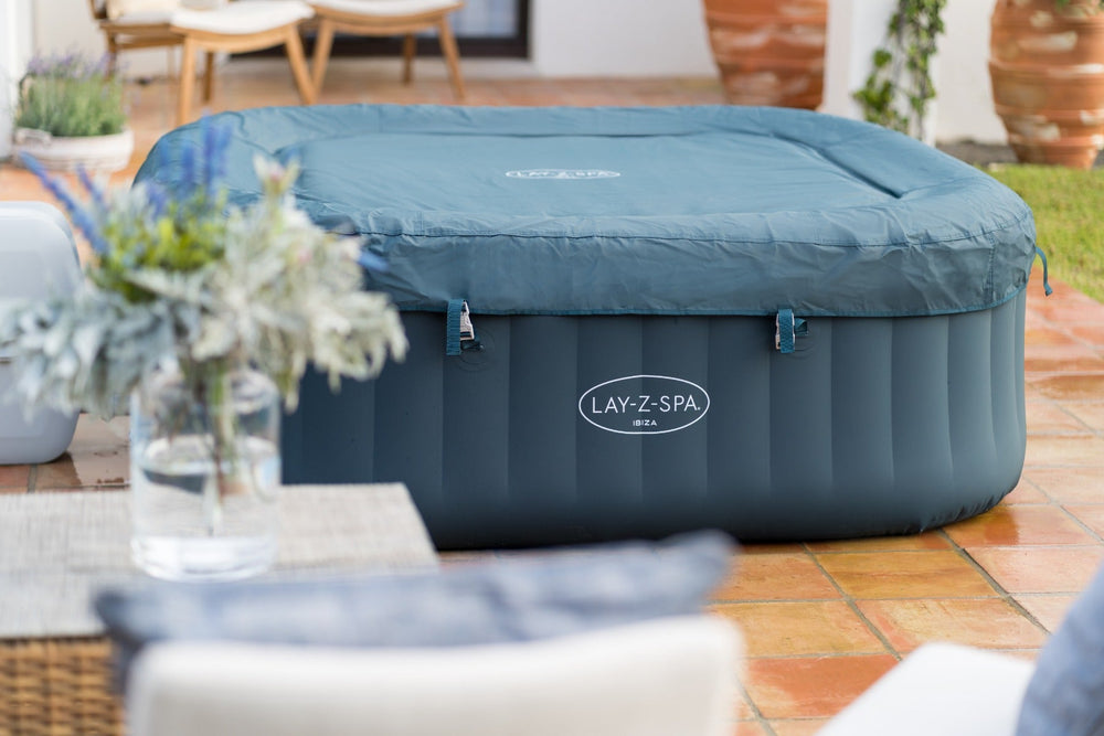 Ryny Ibiza AirJet hot tub with people relaxing outdoors