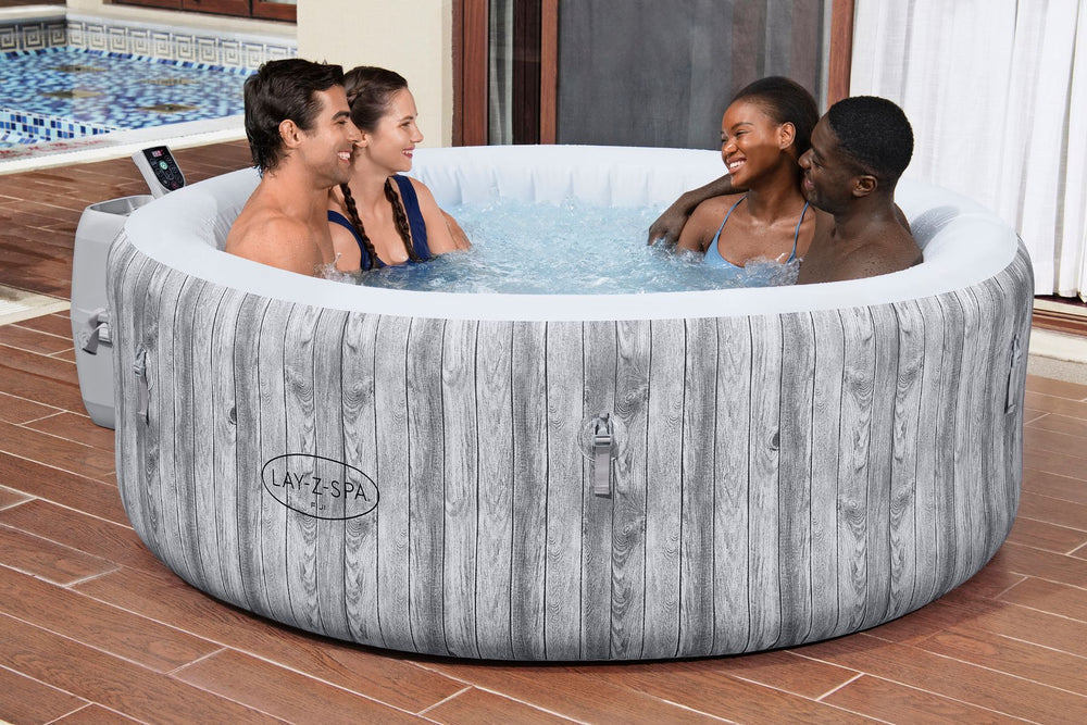 Ryny Fiji AirJet round hot tub with people relaxing