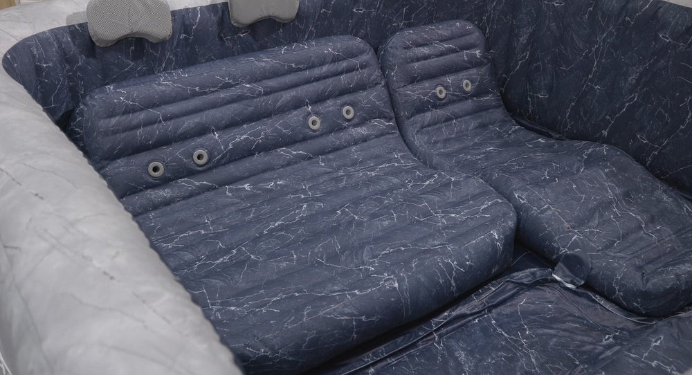 Inflatable hot tub with padded seats installed in backyard
