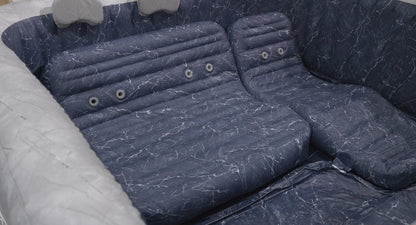 Inflatable hot tub with padded seats installed in backyard