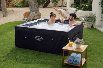 Ryny Stockholm AirJet hot tub with family in backyard