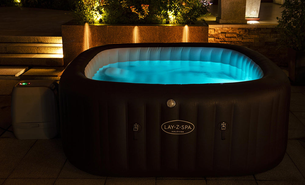lay-Z-Spa Maldives hot tub nighttime setup with blue LED lights