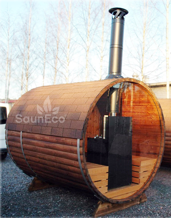 Panorama barrel sauna with log-fired heater installed outdoors