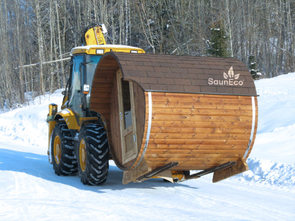 Small barrel sauna lodge side view showing thermowood construction