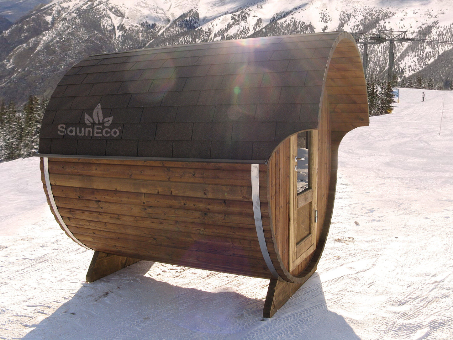 Small barrel sauna lodge installed outdoors