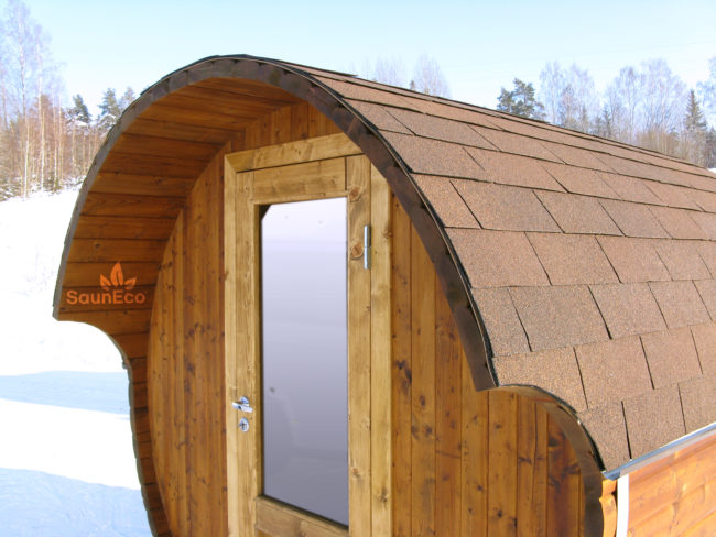 Small barrel sauna lodge side view showing thermowood construction