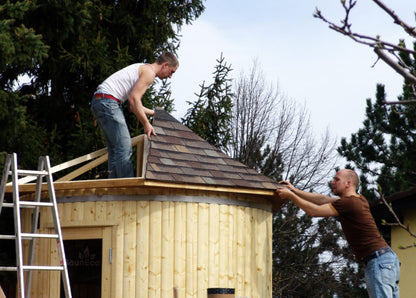Upright garden sauna lodge side view showing thermowood construction