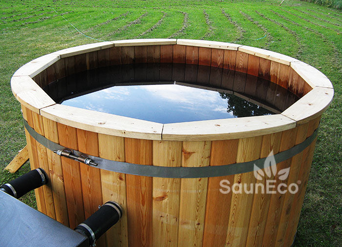 People soaking in Barrel Saunas Medium Larch Wood Hot Tub outdoors